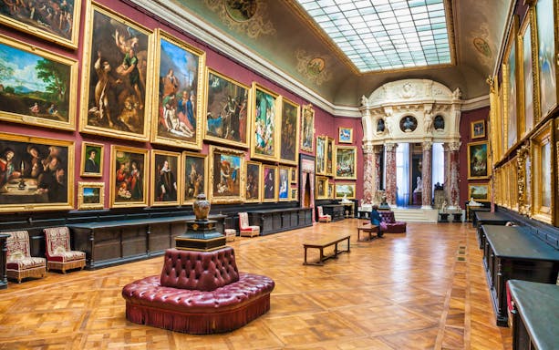 Chateau of Chantilly painting gallery with ornate artworks and elegant interior.