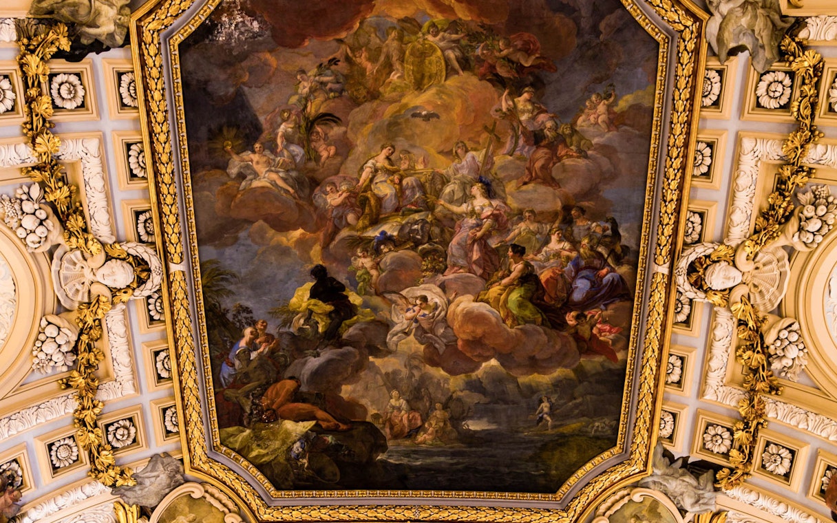 Royal Palace ceiling fresco with mythological figures and ornate gold detailing.