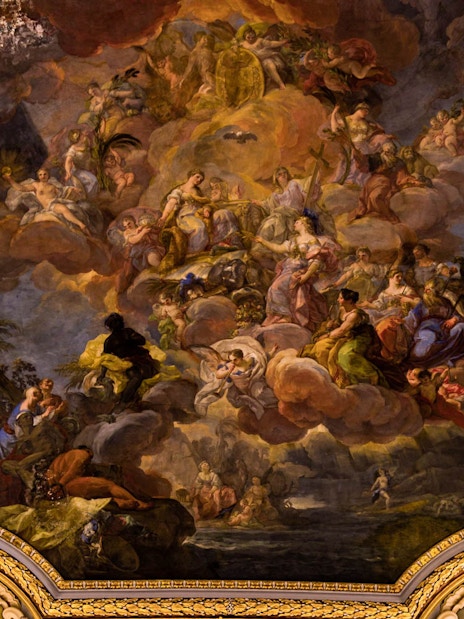 Royal Palace ceiling fresco with mythological figures and ornate gold detailing.