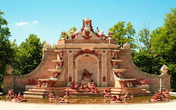 Fountain with intricate sculptures at Royal Palace of San Ildefonso, Spain.