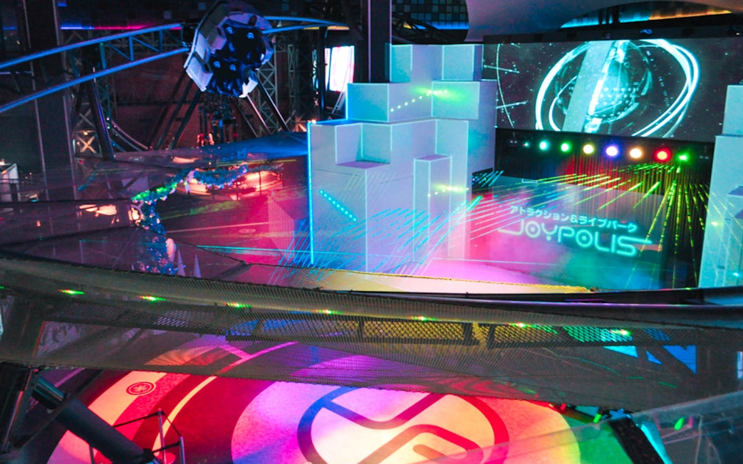 Thrilling rides and vibrant lights at Tokyo JOYPOLIS indoor theme park in Odaiba, Tokyo.
