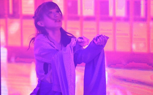 Performer in traditional attire at Roppongi KAGUWA Entertainment Show, Tokyo.