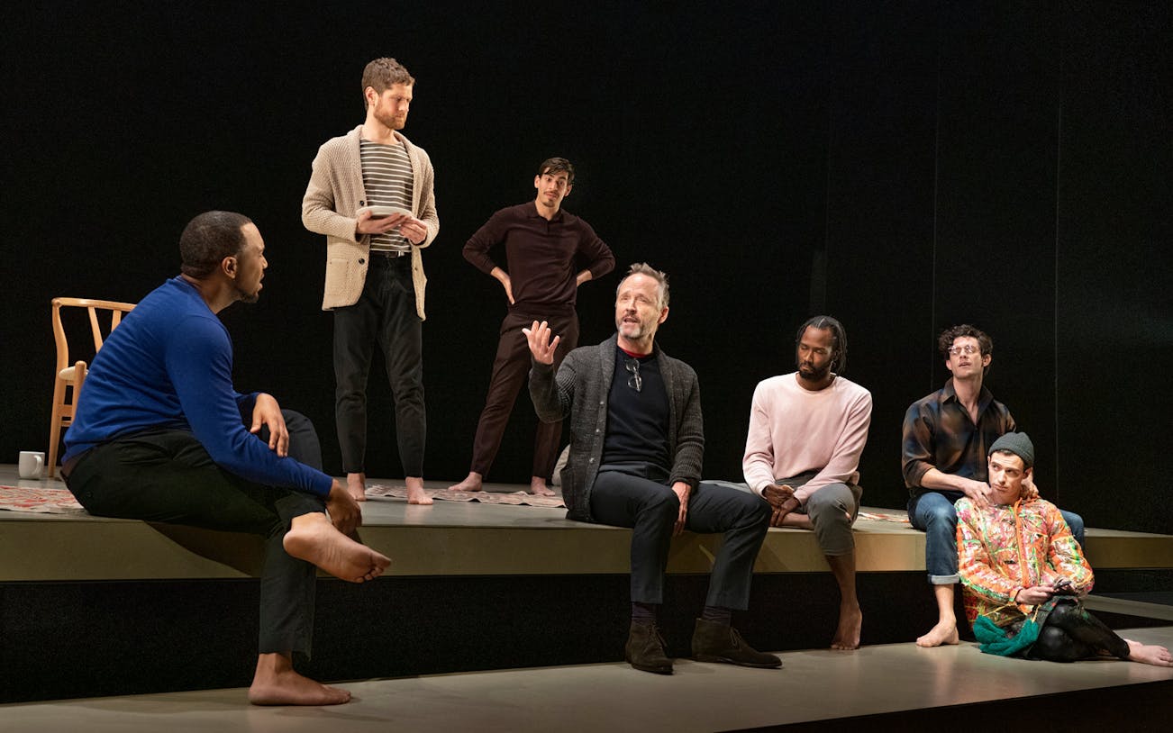Actors performing a scene from "The Inheritance Part 1" on Broadway stage.