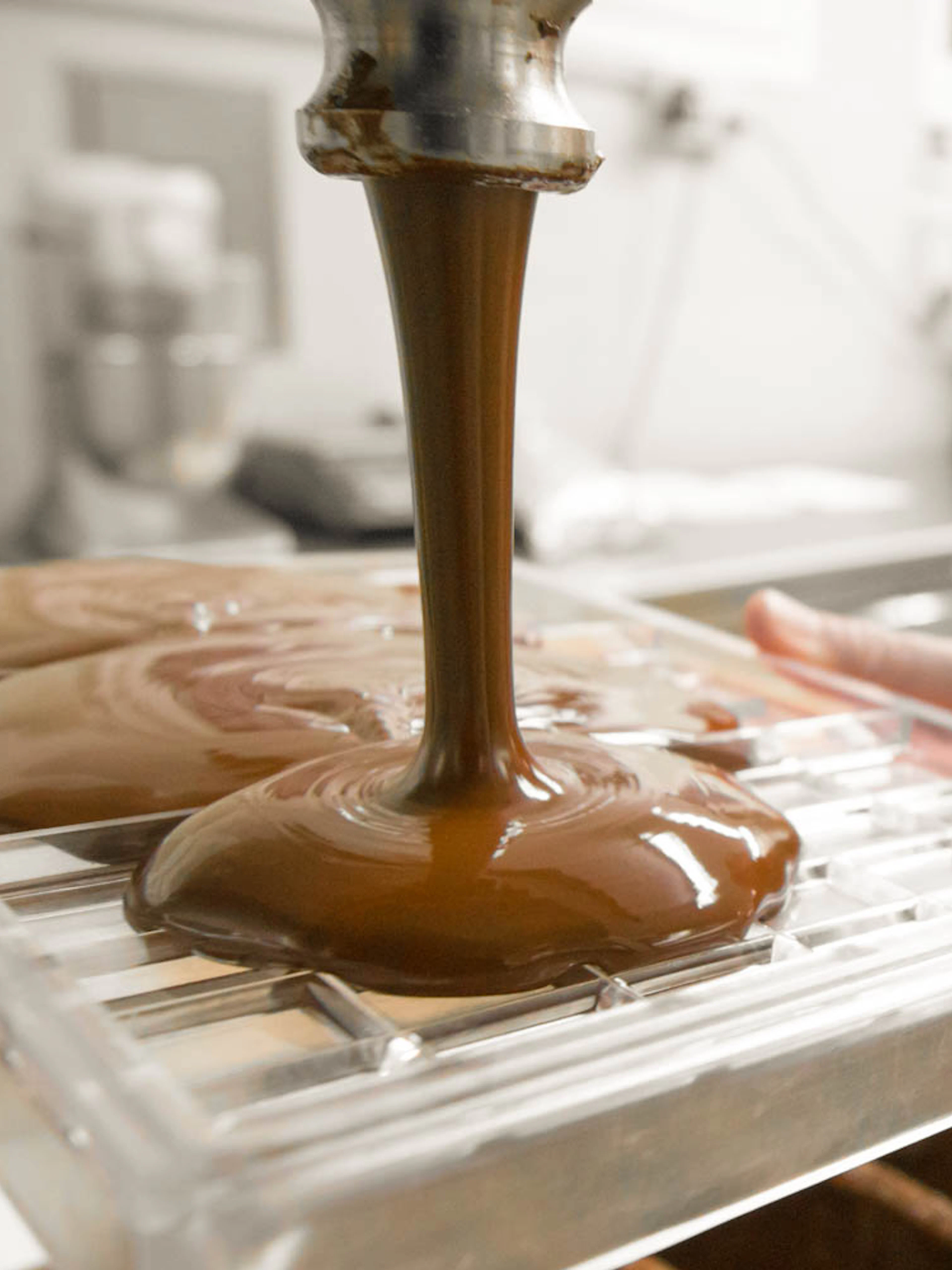Chocolate being poured into molds during a tasting tour in Venice.