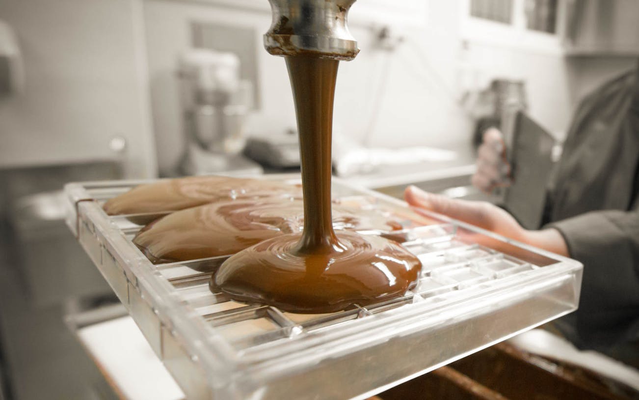 Chocolate being poured into molds during a tasting tour in Venice.
