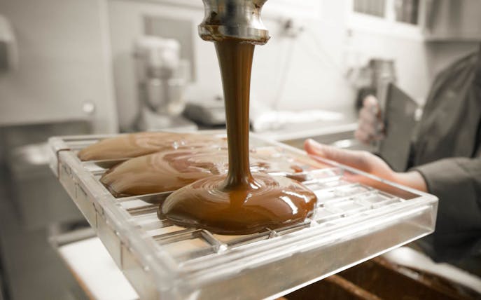 Chocolate being poured into molds during a tasting tour in Venice.