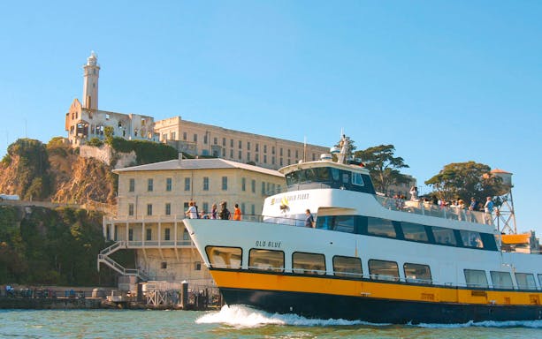 Ferry approaching Alcatraz Island in San Francisco Bay, part of the San Francisco Explorer Pass.