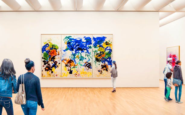 Visitors viewing abstract art at a San Francisco museum.