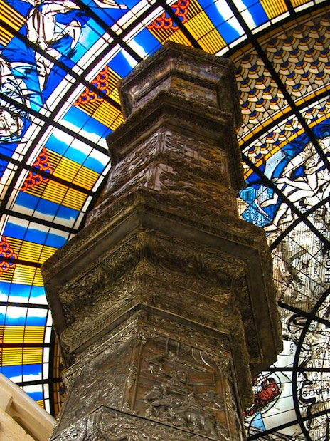 Stained glass ceiling and ornate pillar inside Erawan Museum, Bangkok.