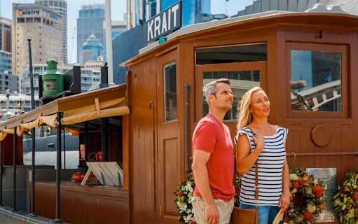Couple exploring the Krait vessel at the Australian National Maritime Museum, Sydney.