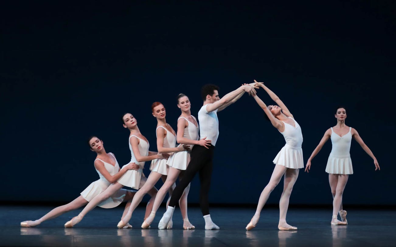 Ballet dancers performing a George Balanchine choreography on stage.