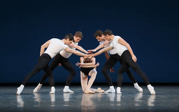 Ballet dancers performing a George Balanchine choreography on stage.