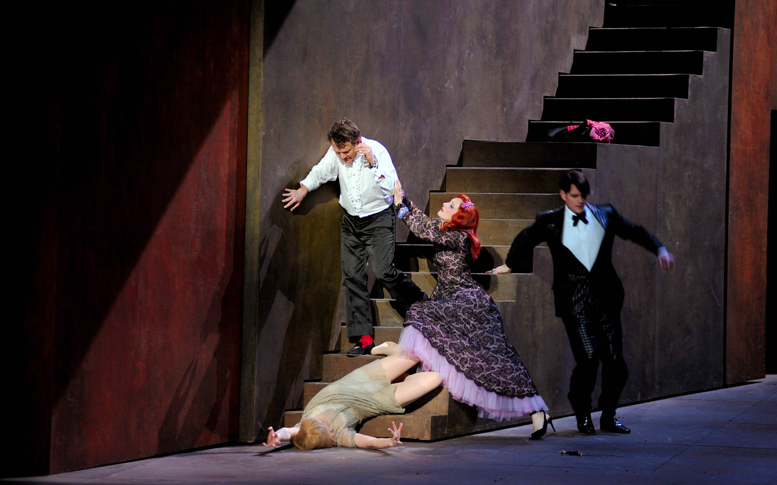 Opera scene from "Yvonne, Princesse de Bourgogne" with actors on a staircase.