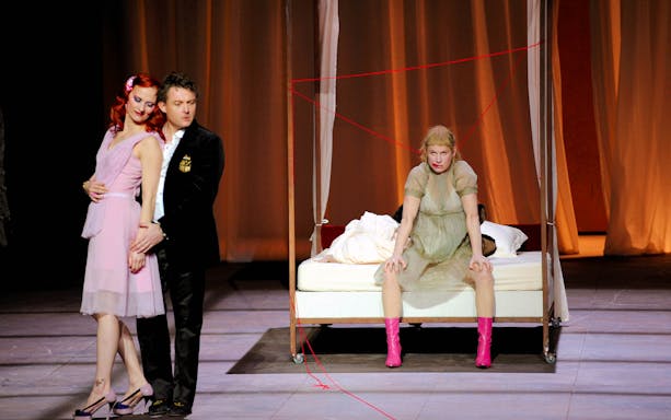 Theatrical scene from "Yvonne, Princesse de Bourgogne" with actors on stage.
