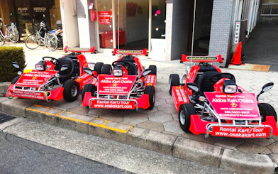 Go-karts parked outside Akiba Kart Osaka for street tour experience.