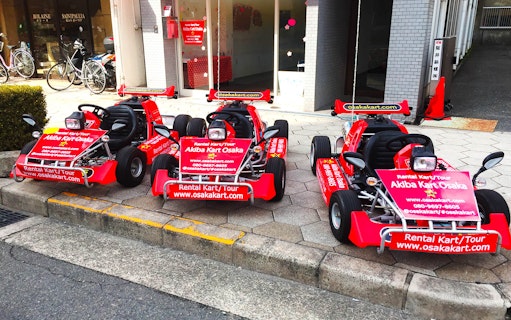 Go-karts parked outside Akiba Kart Osaka for street tour experience.