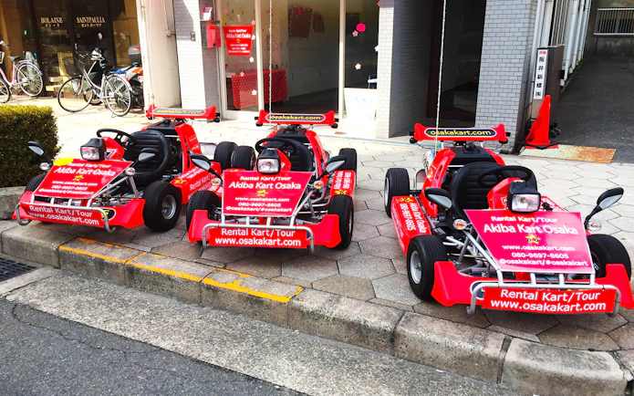 Go-karts parked outside Akiba Kart Osaka for street tour experience.