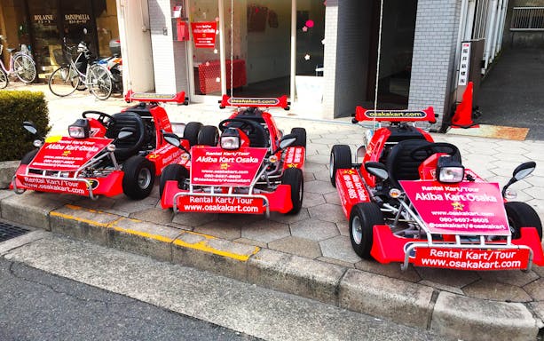 Go-karts parked outside Akiba Kart Osaka for street tour experience.
