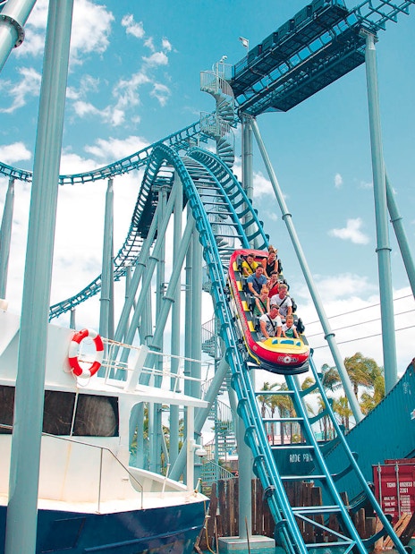 Roller coaster at Gold Coast Sea World with passengers descending a steep track.