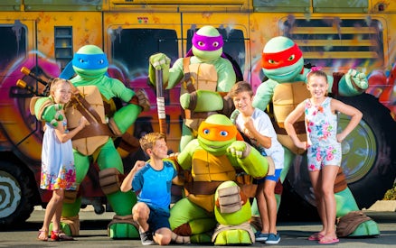 Children posing with turtle characters at Gold Coast Sea World.