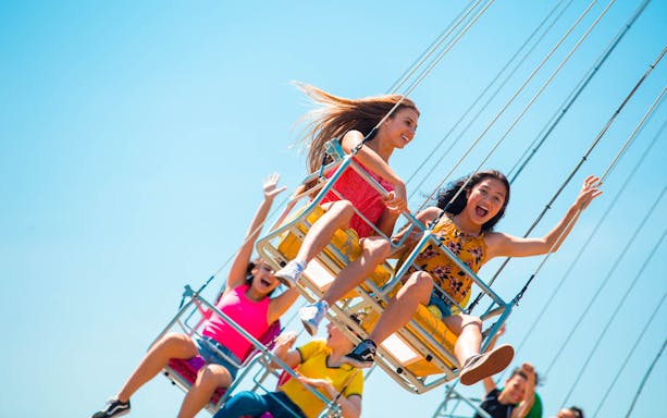 Visitors enjoying a swing ride at Gold Coast Sea World.