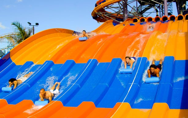 Visitors enjoying water slides at Wet 'n' Wild park.
