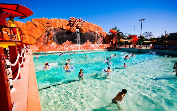 Visitors enjoying the wave pool at Wet 'n' Wild water park.