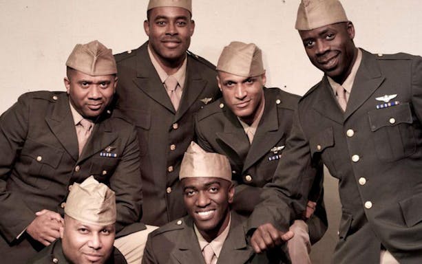 Actors in military uniforms from the play "Black Angels Over Tuskegee" ensemble.