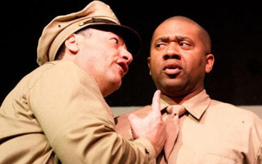 Actors in military uniforms performing "Black Angels Over Tuskegee" play.