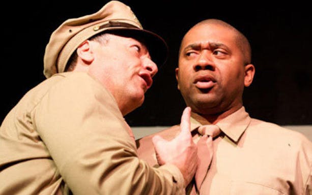 Actors in military uniforms performing "Black Angels Over Tuskegee" play.