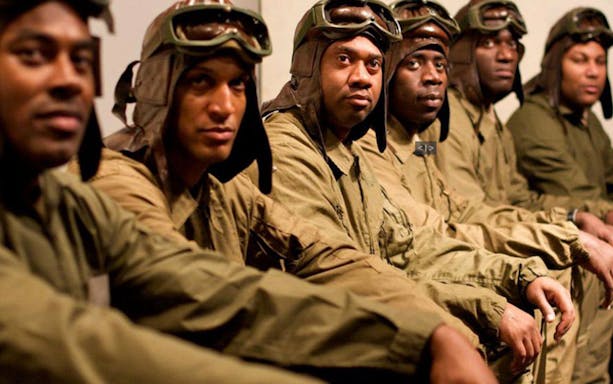 Pilots in vintage flight gear from Black Angels Over Tuskegee performance.
