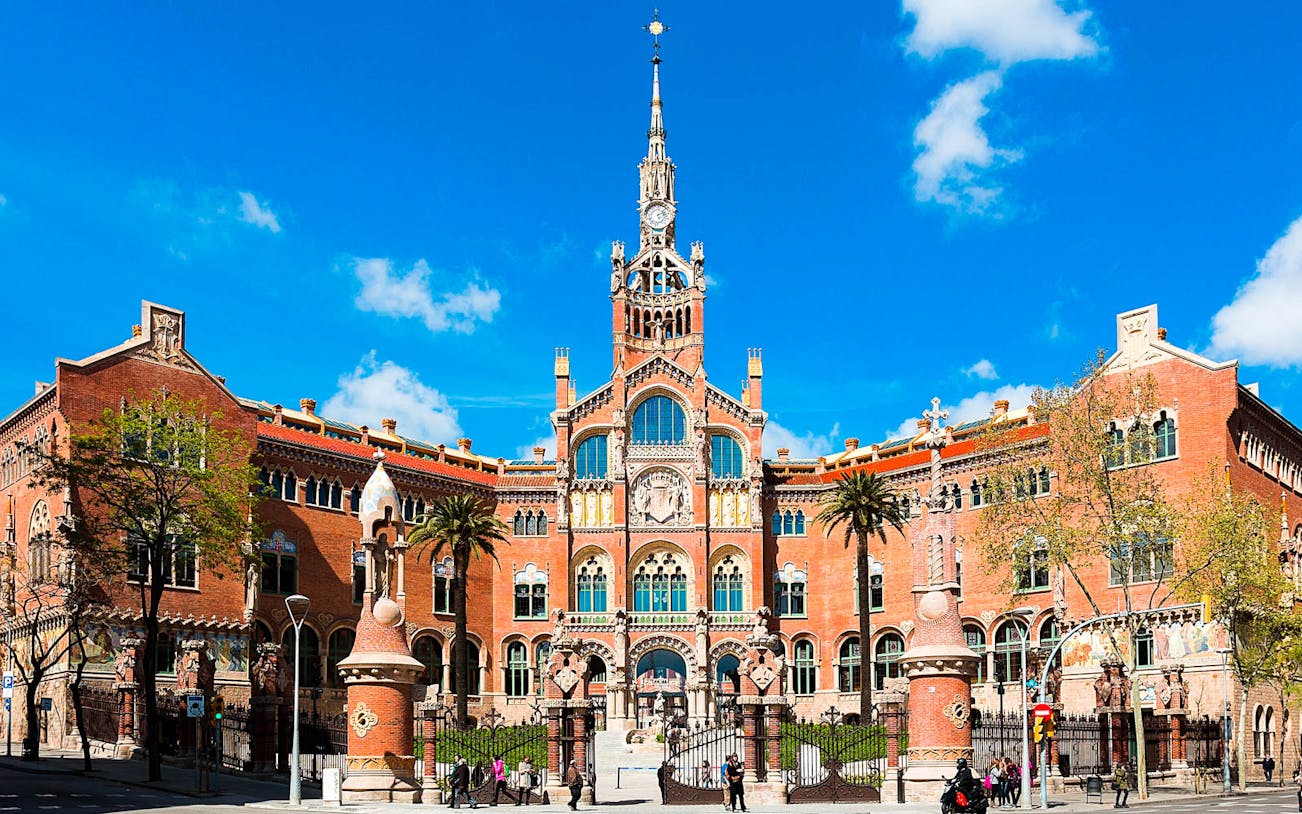 Sant Pau Art Nouveau site in Barcelona with intricate architecture and palm trees.