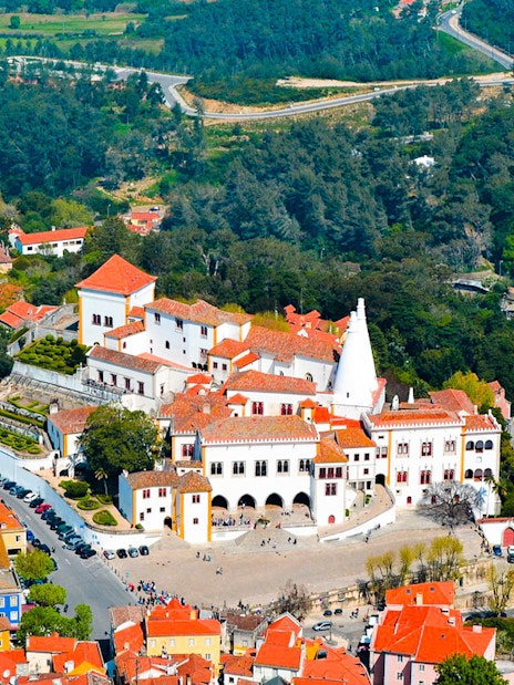 Aerial view of the National Palace of Sintra with surrounding landscape in Portugal.