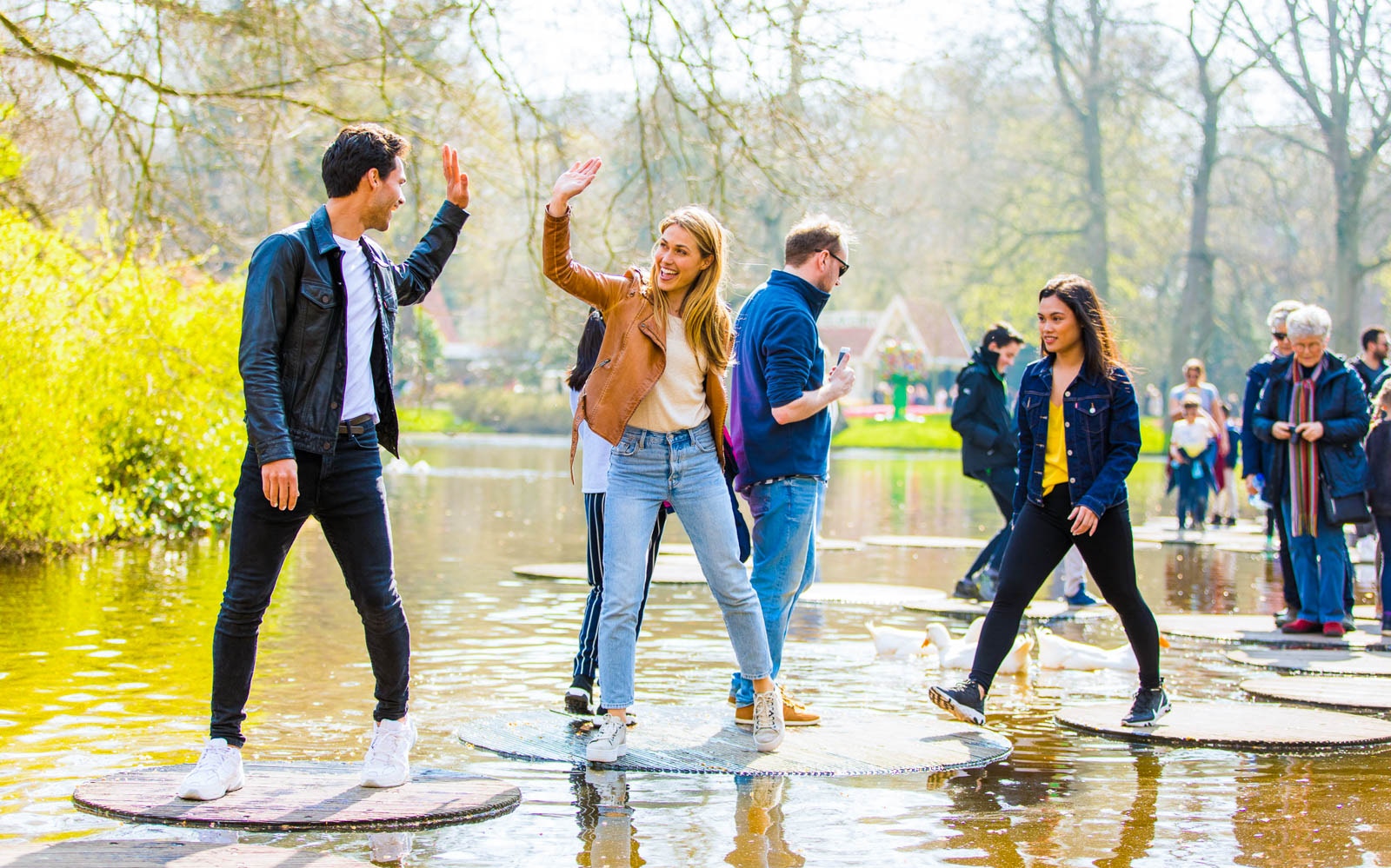 Visitors enjoying stepping stones at Keukenhof Gardens, Netherlands.