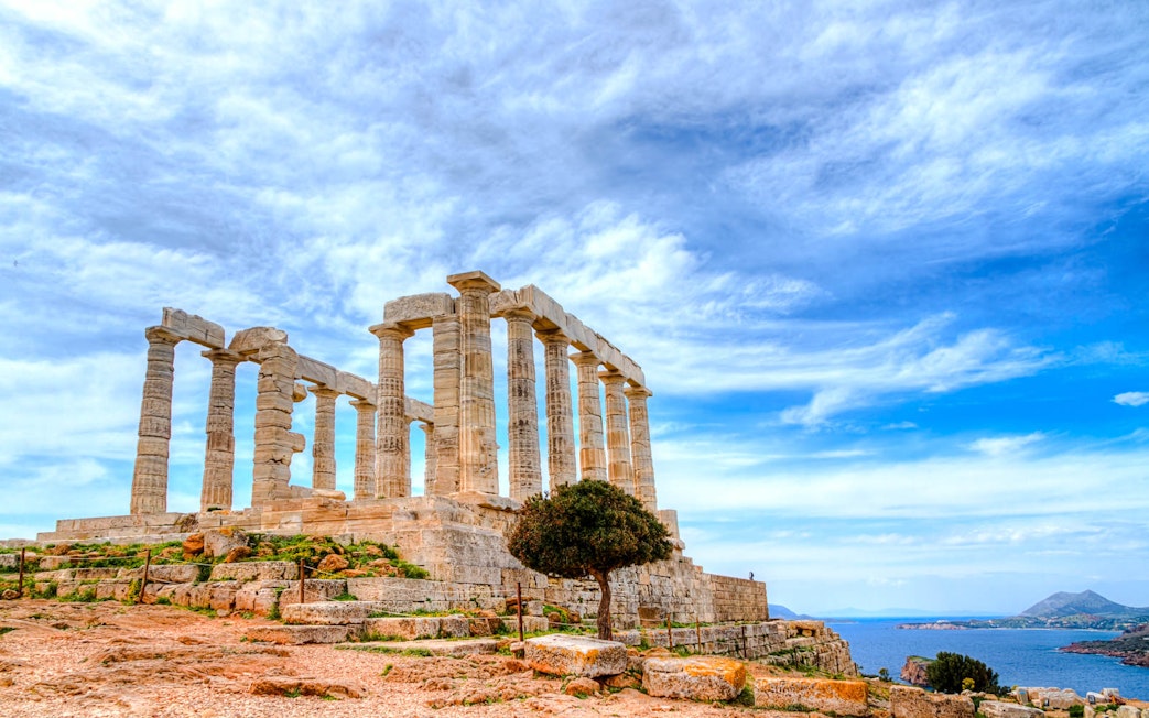 Temple of Poseidon at Cape Sounion with sea view, part of guided tour from Athens.