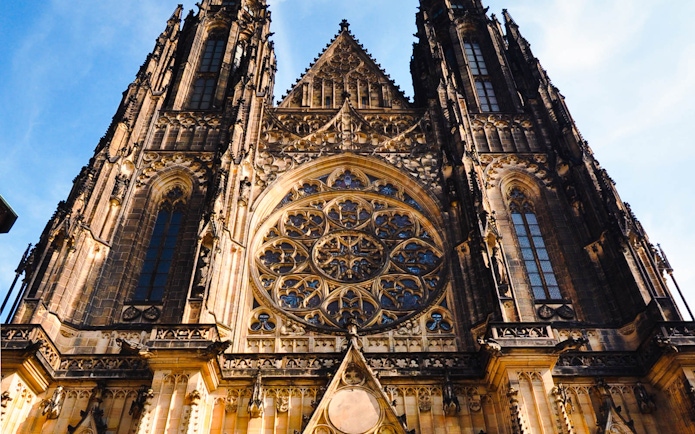 Prague Castle facade with intricate Gothic architecture details.