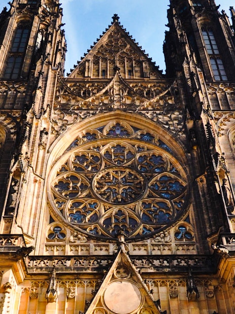 Prague Castle facade with intricate Gothic architecture details.
