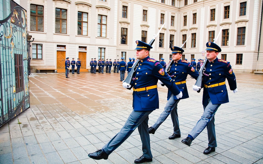 Changing of the guard ceremony at Prague Castle courtyard.