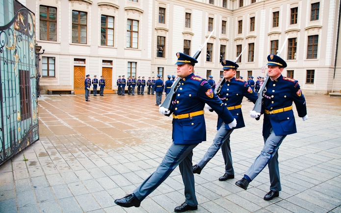 Changing of the guard ceremony at Prague Castle courtyard.