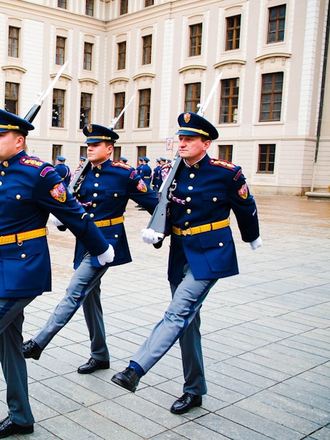 Changing of the guard ceremony at Prague Castle courtyard.