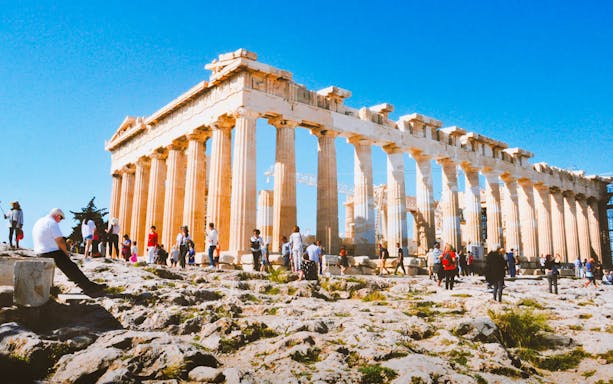 Tourists exploring the Parthenon in Athens, Greece.
