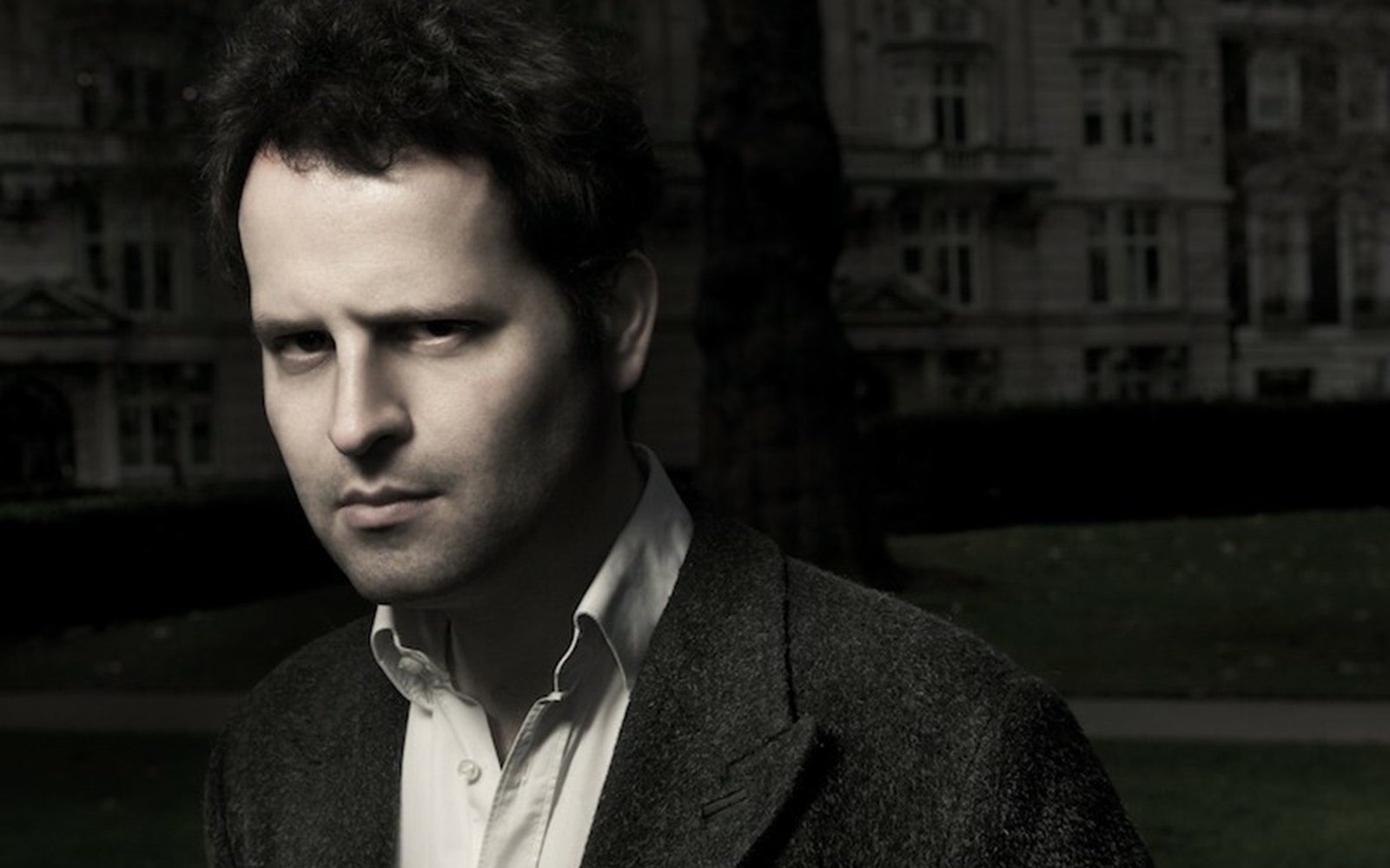 Author in a dark setting, related to "Adam Kay: This Is Going to Hurt" tour.