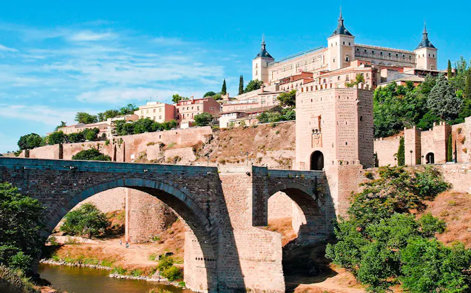 Toledo's Alcázar and Puente de Alcántara on a guided tour from Madrid.