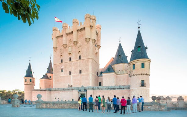 Group of tourists at the Alcázar of Segovia during a guided tour from Madrid.