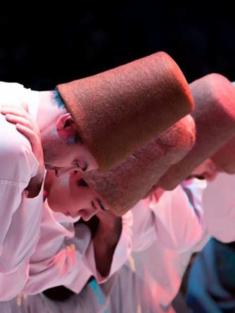 Whirling dervishes bowing at Hodjapasha Cultural Centre, Istanbul.