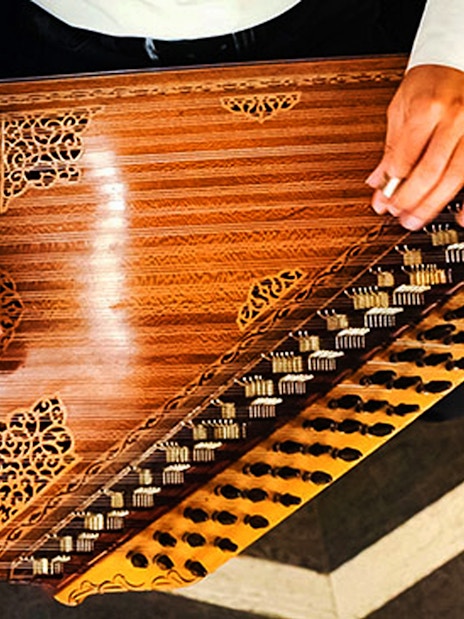 Musician playing qanun at Istanbul Whirling Dervish Show, Hodjapasha Cultural Centre.