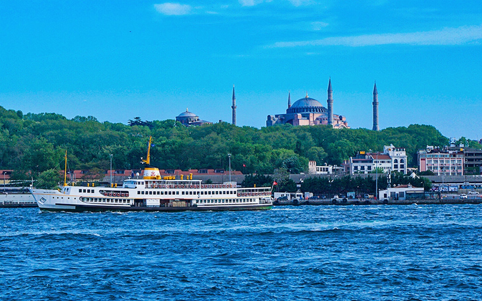 Bosphorus cruise ship with Hagia Sophia in the background, Istanbul.