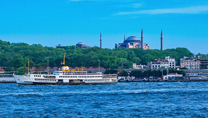 Golden Horn and Bosphorus boat cruising past Istanbul landmarks.