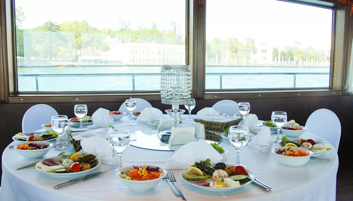 Bosphorus 2-Course Lunch Cruise sailing towards the Black Sea with tourists enjoying the view of Istanbul's skyline