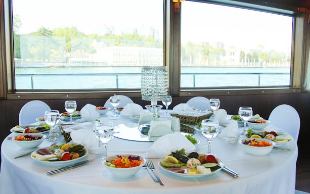 Lunch table set on Bosphorus cruise with view of the Black Sea.